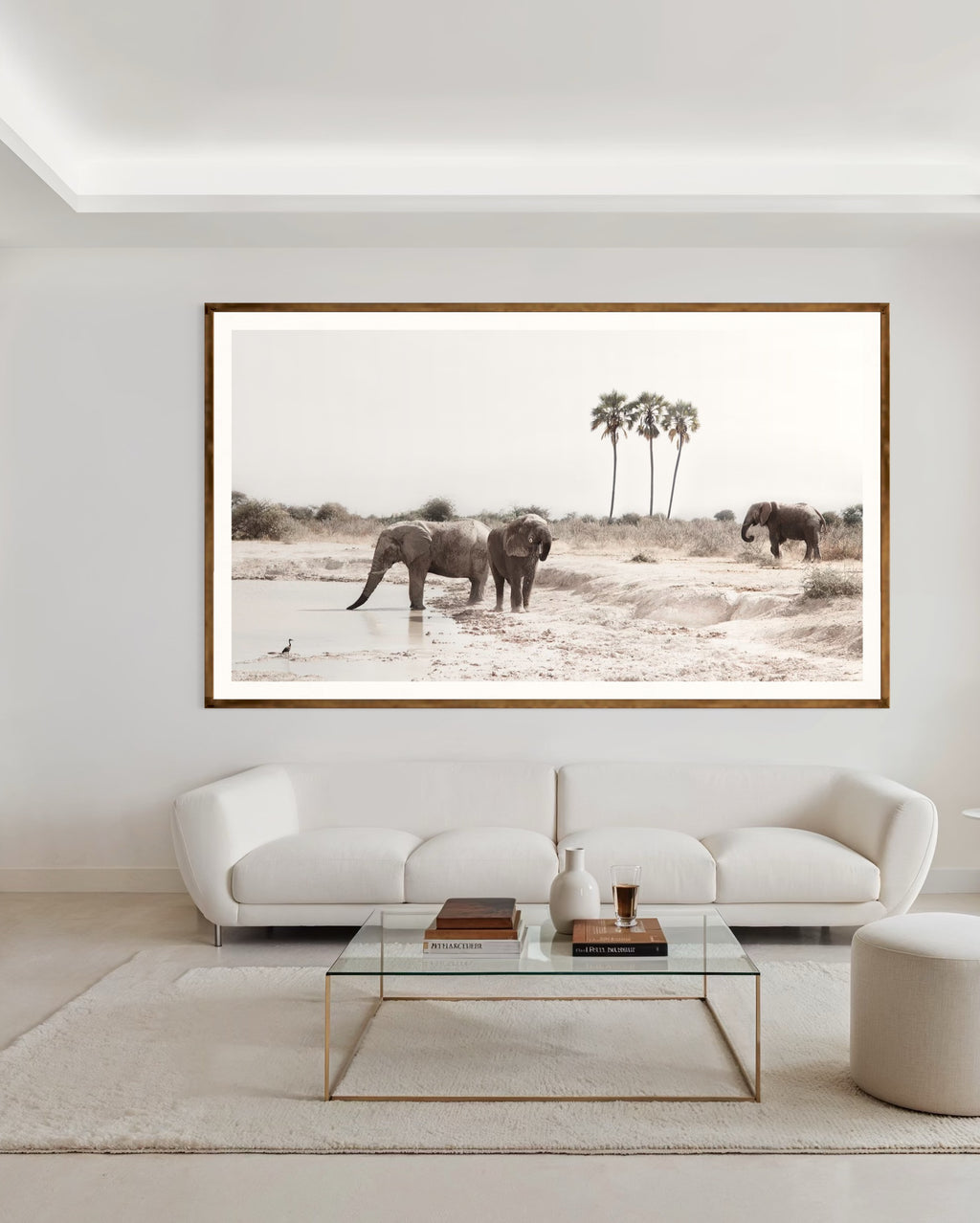 Modern interior featuring a framed artwork of a portrait of a family of elephants at a watering hole by Francoise V Fine Art Gallery in Cape Town, South Africa