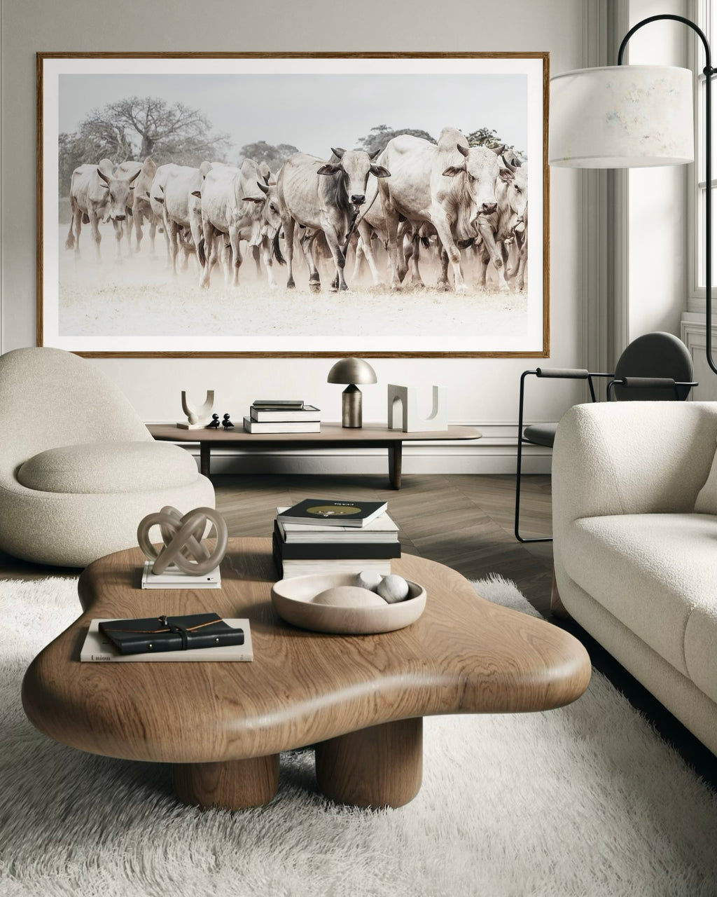 Modern interior featuring a framed artwork of a portrait of a herd of cattle by Francoise V Fine Art Gallery in Cape Town, South Africa