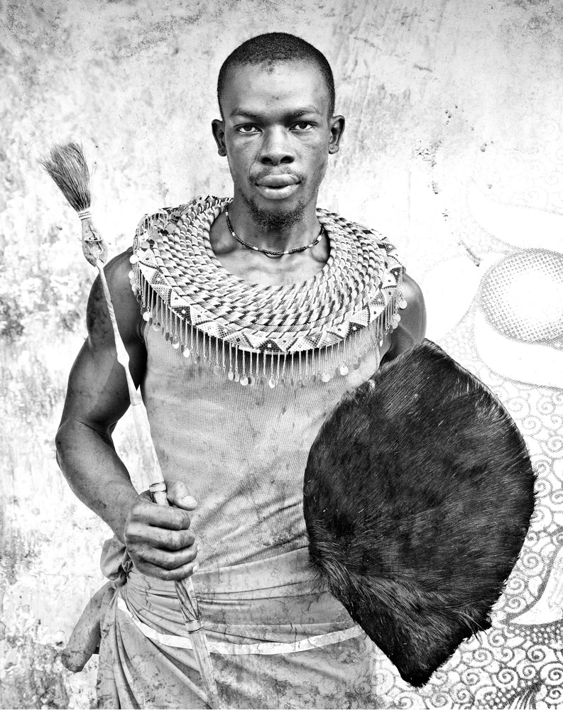 Artwork print of a Black and white portrait of a man holding a shield and spear against a textured wall by Francoise V Fine Art Gallery in Cape Town, South Africa