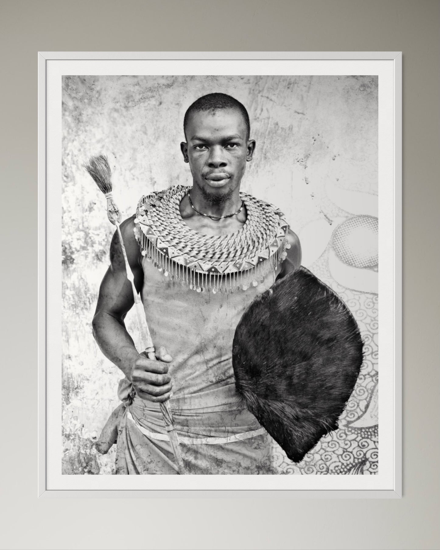 White box-framed Black and white portrait of a man holding a shield and spear against a textured wall by Francoise V Fine Art Gallery in Cape Town, South Africa